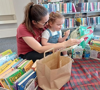 Parent and child reading together