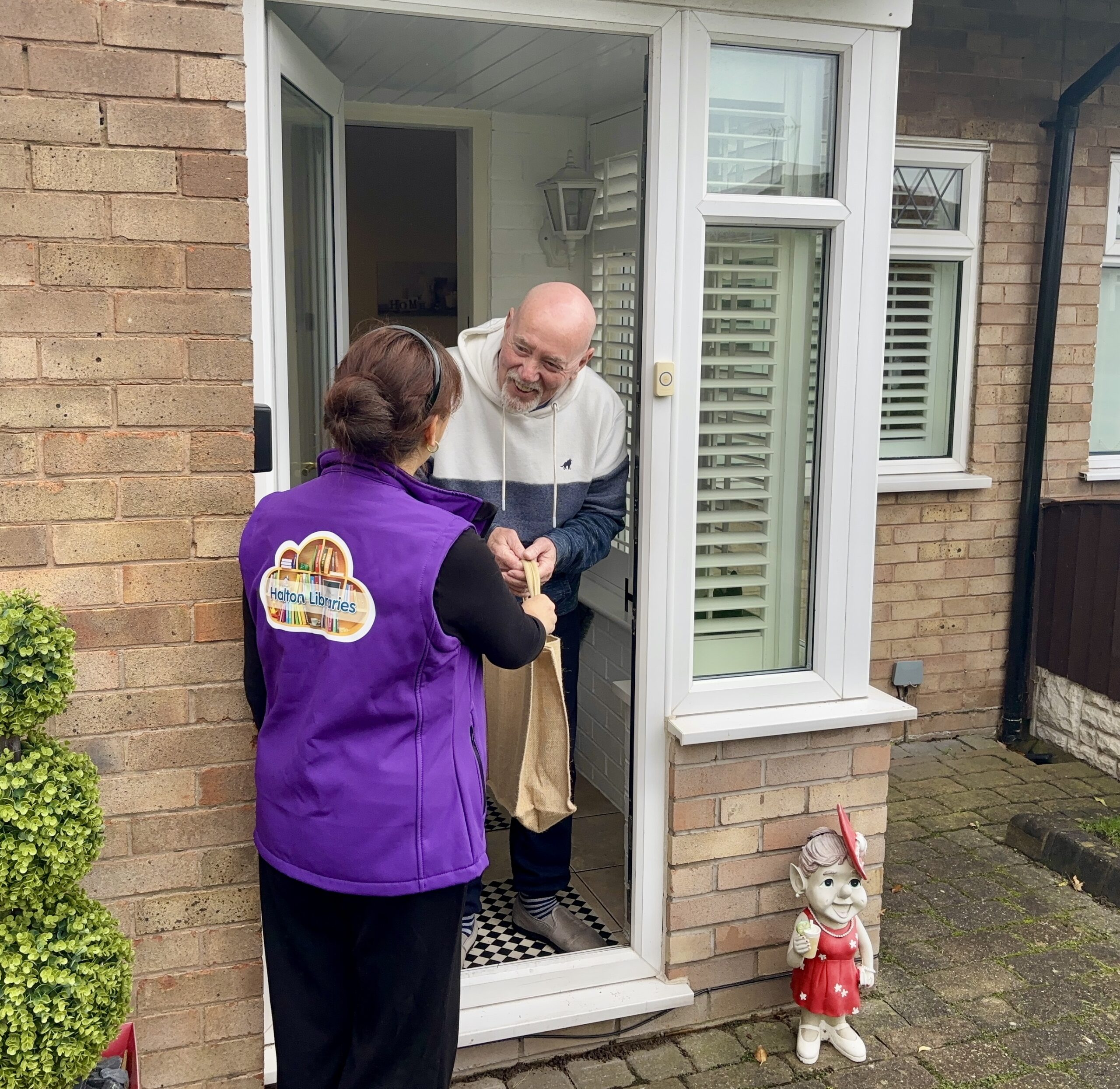 A customer receiving a home library service delivery